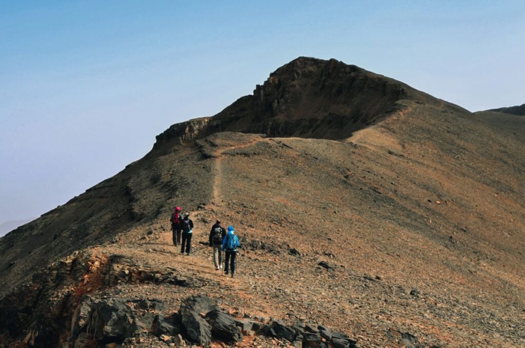 Summit of Jbel M'Goun at 4,068 metres — M'Goun trek Morocco's highest point with views to the Sahara