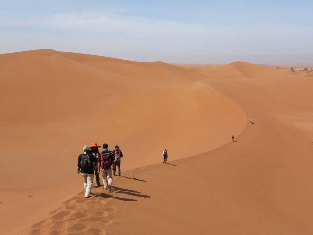 Morocco trek and desert combo — hiking the High Atlas mountains and camel trekking in Erg Chebbi Sahara dunes in one trip